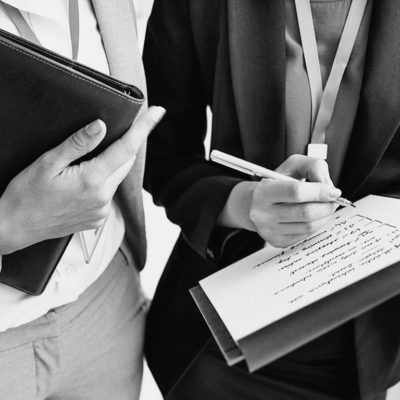 businesswoman-corporate-colleagues-talking-PN43L3X businesswoman-corporate-colleagues-talking-PN43L3X